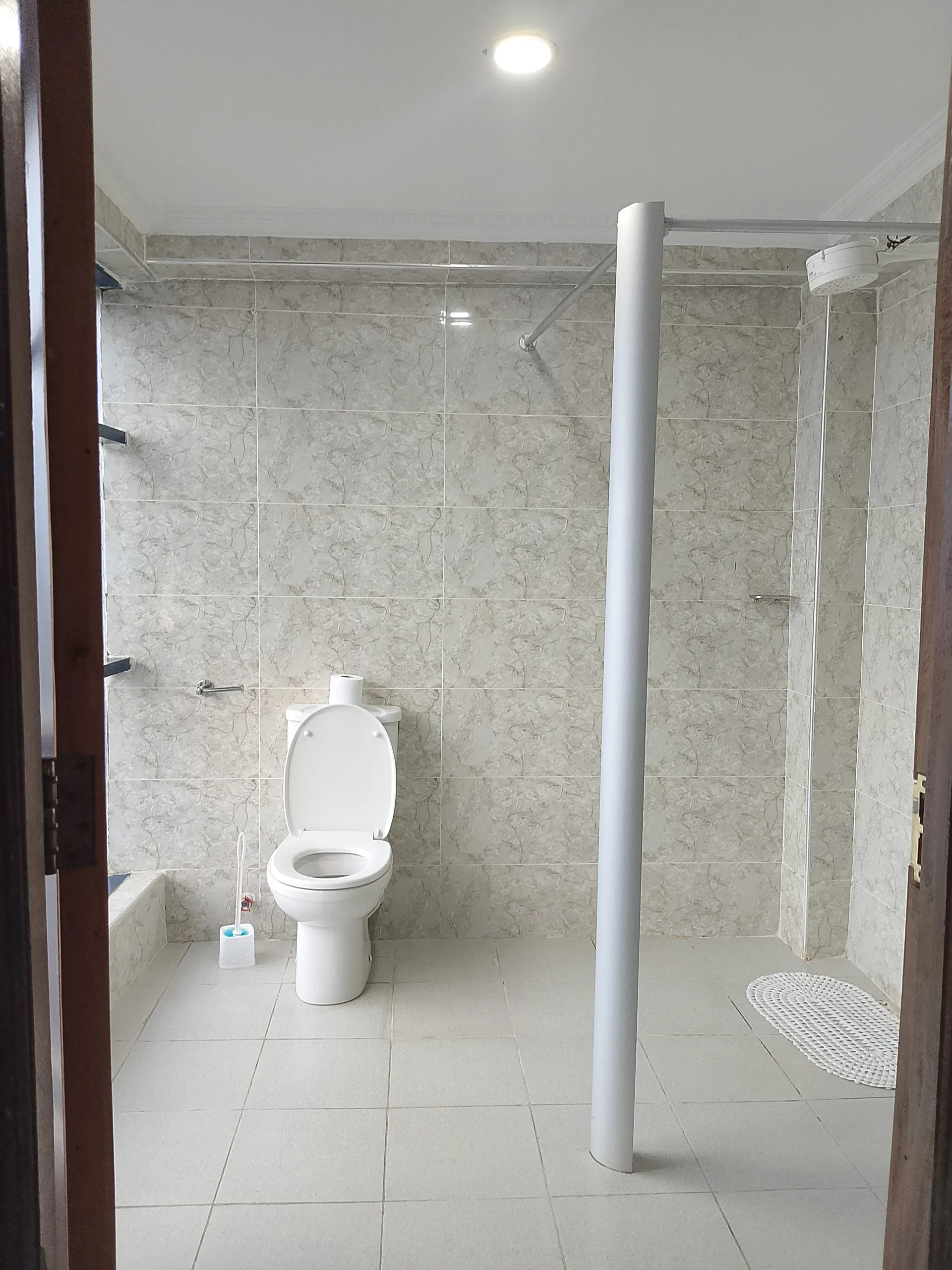 En-suite bathroom in a double room at Generis Hotel, with hot shower