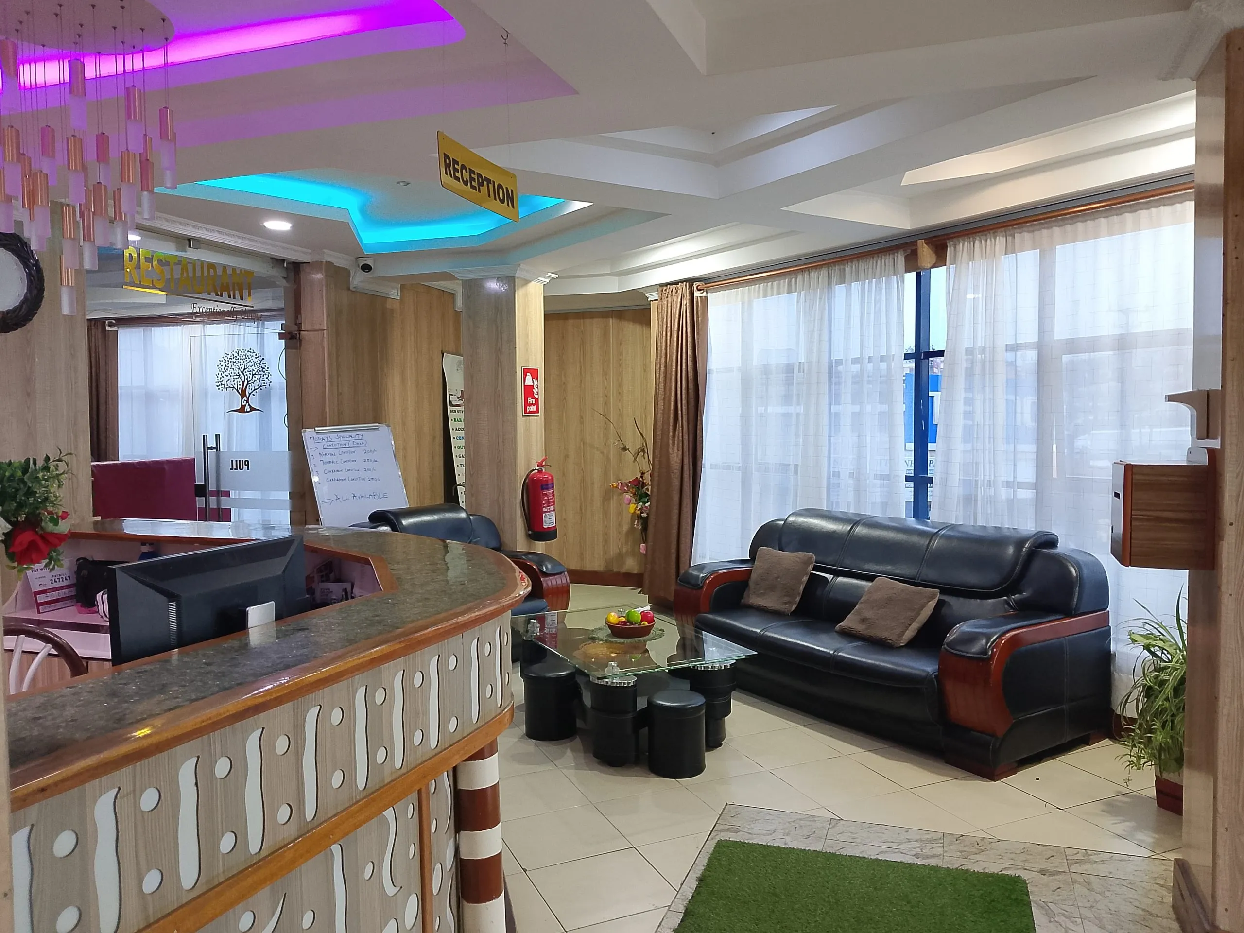 Reception area with seating and warm lighting at Generis Hotel