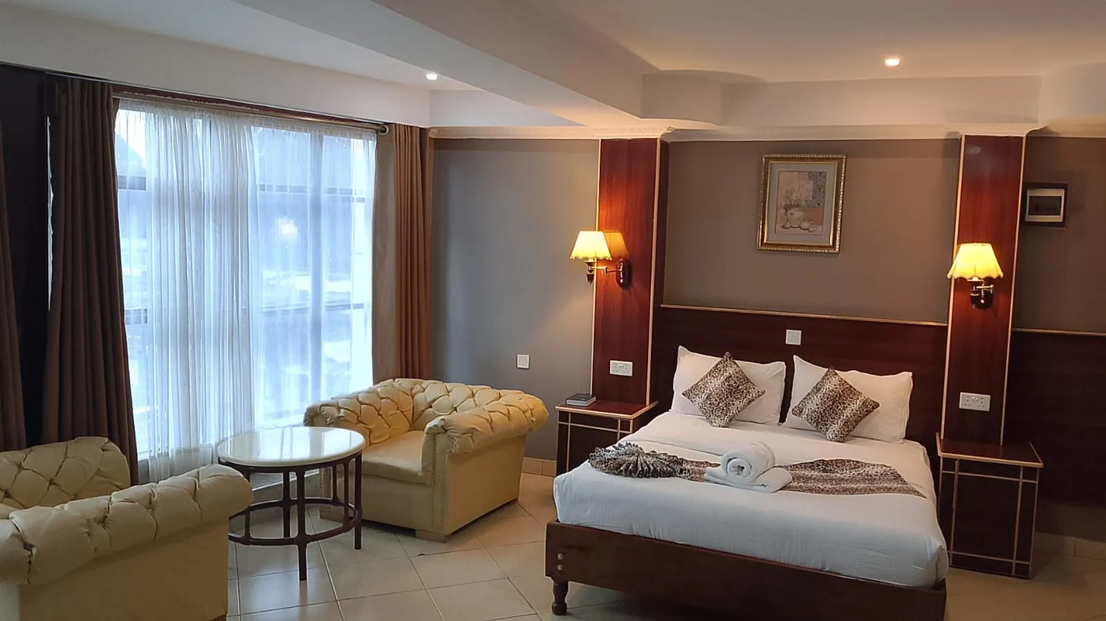 A double room at Generis Hotel with one large bed, suited to couples