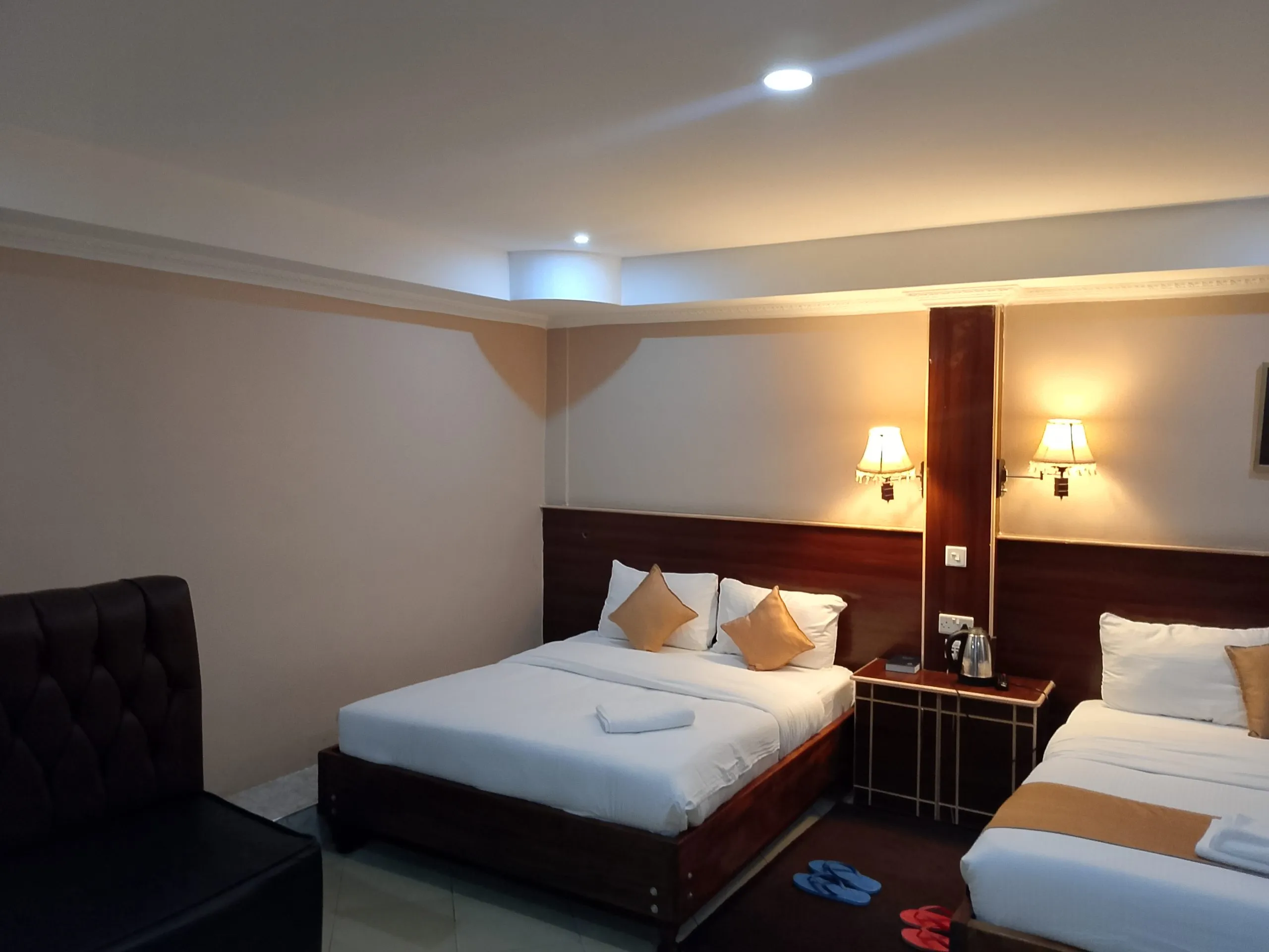 Twin room at Generis Hotel showing both beds and the window